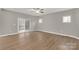 Expansive living room featuring wood-look floors and sliding glass doors to the back porch at 5051 Oxbow Run Ln, York, SC 29710