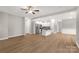 Spacious open-concept living space with a modern kitchen and wood-look flooring at 5051 Oxbow Run Ln, York, SC 29710