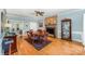 Formal dining room features a decorative fireplace and access to another living space at 506 Abbotsford Ct, Charlotte, NC 28270