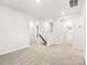 Upstairs hallway with neutral carpet and light walls, with views of the doorways to multiple bedrooms at 5204 Georgette Trl, Cherryville, NC 28021