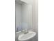 Modern bathroom features a pedestal sink with elegant faucet and large mirror at 5207 Georgette Trl, Cherryville, NC 28021