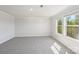 Bright bedroom featuring neutral walls, plush carpet, and natural light from the double windows at 5207 Georgette Trl, Cherryville, NC 28021