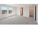 Bright bedroom featuring neutral walls, plush carpet, and natural light from the double windows at 5207 Georgette Trl, Cherryville, NC 28021
