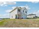 New two-story home with a two-car garage, teal door, and situated on a spacious grassy lot at 5207 Georgette Trl, Cherryville, NC 28021