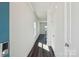 Inviting hallway features sleek wood flooring and neutral walls, leading to the main living areas at 5207 Georgette Trl, Cherryville, NC 28021