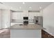 Open kitchen features white cabinets, granite countertops, and a central island at 5207 Georgette Trl, Cherryville, NC 28021