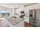 Modern kitchen features granite countertops, stainless steel appliances, and ample cabinet space at 5207 Georgette Trl, Cherryville, NC 28021