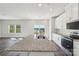 Spacious kitchen with island, white cabinetry, and modern stainless steel appliances at 5207 Georgette Trl, Cherryville, NC 28021