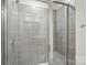 Modern tile shower featuring glass door, built-in seat, and sleek fixtures at 5207 Georgette Trl, Cherryville, NC 28021