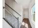 Staircase features carpeted steps and white railings leading to the upper level of the home at 5207 Georgette Trl, Cherryville, NC 28021