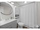 Bathroom featuring a vanity, toilet, and shower with a white curtain at 623 S New Hope Rd # 4, Gastonia, NC 28054