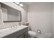 Bathroom features gray vanity, neutral walls, and modern lighting at 623 S New Hope Rd # 4, Gastonia, NC 28054