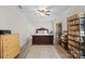 Bedroom with wood-look floors, ceiling fan, a large rug, and record collection at 623 S New Hope Rd # 4, Gastonia, NC 28054
