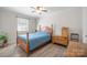 Bedroom with wood-look floors and ceiling fan at 623 S New Hope Rd # 4, Gastonia, NC 28054