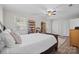 A cozy bedroom featuring bright windows, wood-look floors, and a large record collection at 623 S New Hope Rd # 4, Gastonia, NC 28054