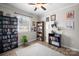 Bedroom with a ceiling fan and a large window for natural light and shelving at 623 S New Hope Rd # 4, Gastonia, NC 28054