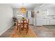 Dining room with a wooden table, patterned rug, and natural light at 623 S New Hope Rd # 4, Gastonia, NC 28054