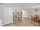 Bright dining room with wood floors and modern lighting adjacent to kitchen at 623 S New Hope Rd # 4, Gastonia, NC 28054