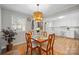 Bright dining room with a wooden table and views into the updated kitchen at 623 S New Hope Rd # 4, Gastonia, NC 28054