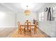 Inviting dining area features a wooden table and chairs, with a decorative pendant light at 623 S New Hope Rd # 4, Gastonia, NC 28054
