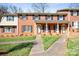 Charming brick townhome featuring black shutters and a well-manicured lawn at 623 S New Hope Rd # 4, Gastonia, NC 28054