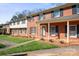 Brick townhome showcases a classic design with black shutters and a welcoming front lawn at 623 S New Hope Rd # 4, Gastonia, NC 28054