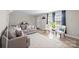 Cozy living room featuring a plush sofa, stylish chairs, and natural light at 623 S New Hope Rd # 4, Gastonia, NC 28054