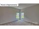 Representative bedroom featuring neutral walls, carpet and bright natural light at 7771 Woolsey Dr, Gastonia, NC 28056