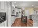 Gourmet kitchen with white cabinets, stainless steel appliances, and a dark wood island at 8034 Bay Pointe Dr, Denver, NC 28037