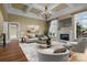Spacious living room features a fireplace, large windows, and modern furnishings at 8034 Bay Pointe Dr, Denver, NC 28037