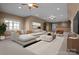 Spacious living room with neutral colors, a large sectional sofa, and two ceiling fans at 8034 Bay Pointe Dr, Denver, NC 28037