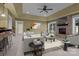Open-concept living room with a stone fireplace, modern furnishings, and plenty of natural light at 8034 Bay Pointe Dr, Denver, NC 28037