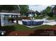 Enjoy this luxurious pool area, featuring comfortable seating, a covered grill, and lush landscaping at 8034 Bay Pointe Dr, Denver, NC 28037