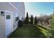 Backyard with artificial turf, fence and view of the city skyline at 932 Cityscape Dr, Charlotte, NC 28205