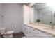 Spacious bathroom featuring double vanity, quartz counters, framed mirror, modern fixtures, and ample cabinet space at 932 Cityscape Dr, Charlotte, NC 28205