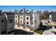 Modern townhomes boast brick accents, individual garages and balconies against the city skyline backdrop at 932 Cityscape Dr, Charlotte, NC 28205