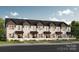 Charming townhomes with modern farmhouse style, black accents, and beautiful landscaping at Lot 8 E Rice St, Landis, NC 28088