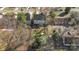 Overhead view of a residential home with a spacious yard, mature trees, and a driveway at 1016 Helms Rd, Charlotte, NC 28214