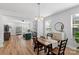 Inviting dining area with an open floor plan, seamlessly connecting to the living room at 1016 Helms Rd, Charlotte, NC 28214