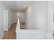 Well-lit hallway with several doors, showcasing the home's spacious layout and design at 1016 Helms Rd, Charlotte, NC 28214
