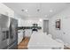 Bright kitchen with white cabinets, a large island, stainless steel appliances and sleek countertops at 1016 Helms Rd, Charlotte, NC 28214