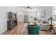 Inviting living room with a large TV, open layout, and stylish decor, perfect for entertaining guests at 1016 Helms Rd, Charlotte, NC 28214