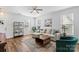 Comfortable living room featuring contemporary decor, ample seating, and a stylish area rug on the floor at 1016 Helms Rd, Charlotte, NC 28214