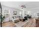 Bright and airy living room with stylish furniture, wood floors, and plenty of natural light at 1016 Helms Rd, Charlotte, NC 28214