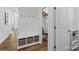 Functional mudroom featuring a bench with storage and coat hooks, offering organized entry at 1016 Helms Rd, Charlotte, NC 28214