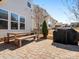 Private backyard featuring a patio, outdoor grill, and a wooden picnic table at 1016 Hickory Pine Rd, Waxhaw, NC 28173