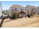 Spacious backyard featuring a covered patio with outdoor seating and a built-in grill, perfect for entertaining at 1016 Hickory Pine Rd, Waxhaw, NC 28173