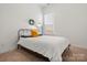 Bright bedroom with a bed, neutral carpet, and window, offering a serene retreat at 1016 Hickory Pine Rd, Waxhaw, NC 28173