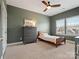 Bedroom featuring an olive-painted wall, ceiling fan, and a window with blinds at 1016 Hickory Pine Rd, Waxhaw, NC 28173