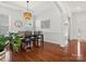 Beautiful dining room with hardwood floors, modern lighting, and ample space for Gathering gatherings at 1016 Hickory Pine Rd, Waxhaw, NC 28173